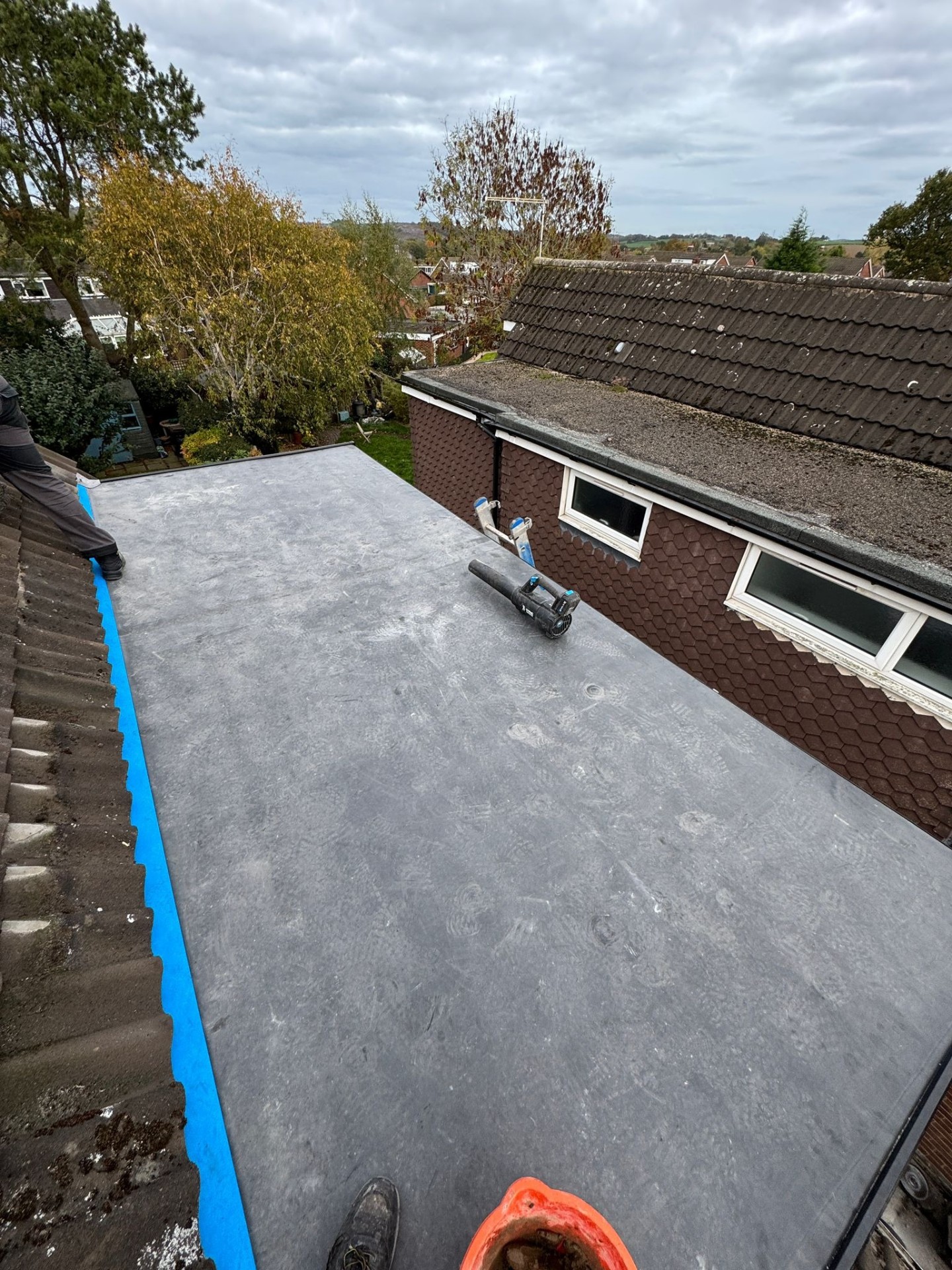 Completed EPDM rubber flat roof membrane installed on a kitchen extension